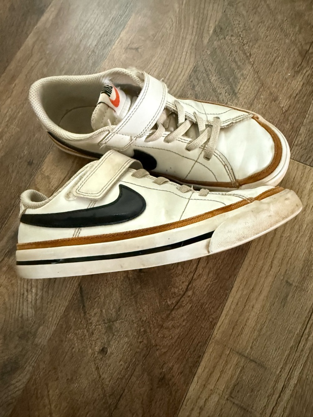 Nike Kids White Sneakers with Black Swoosh and Brown Trim